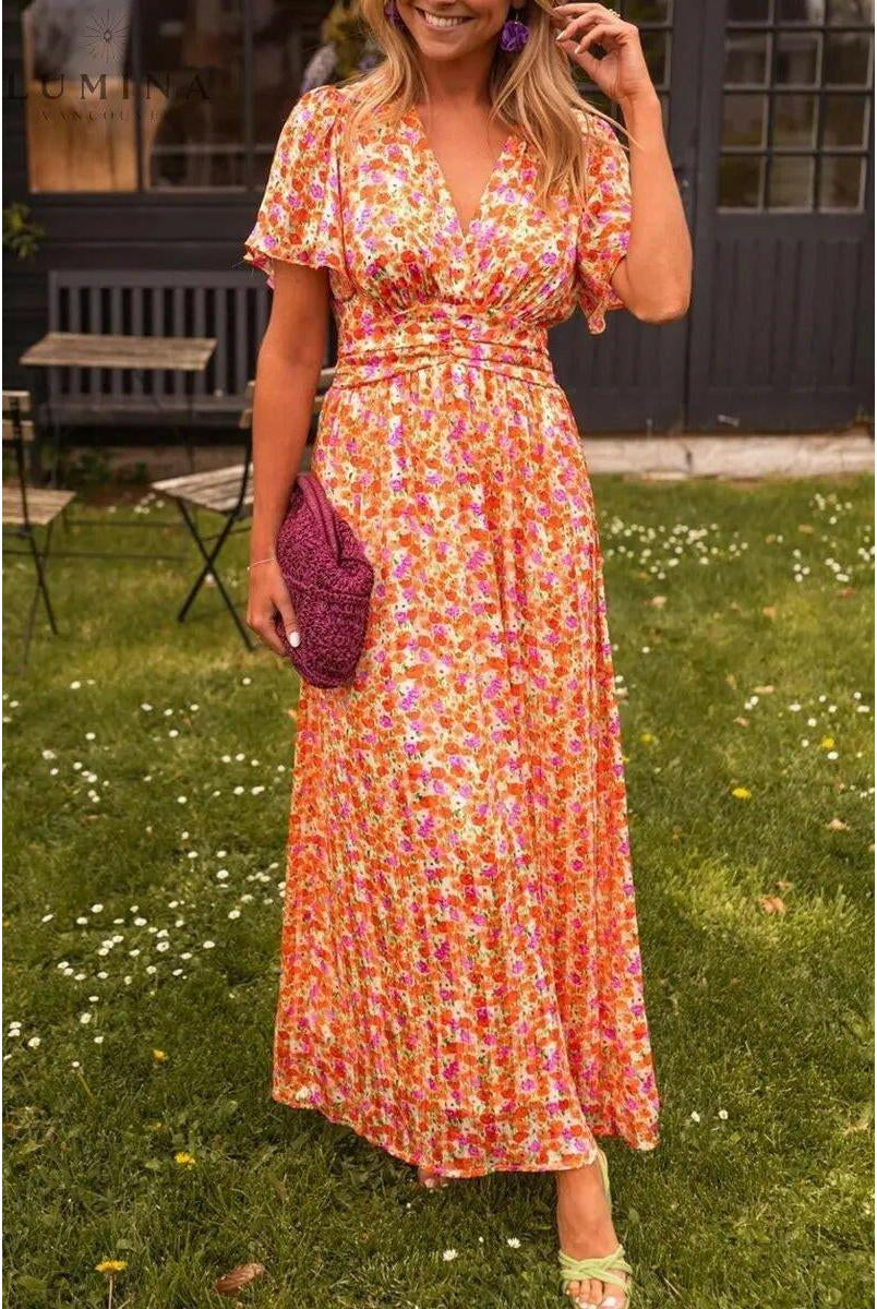 Orange Isabella maxi dress by Lumina Vancouver, perfect for wedding guests, featuring flowing fabric and elegant design.