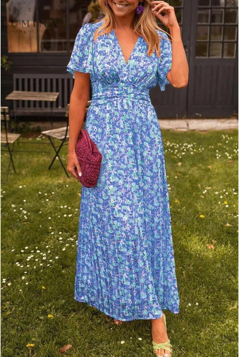 Orange Isabella maxi dress by Lumina Vancouver, elegant wedding guest dress with flowing fabric and stylish design.