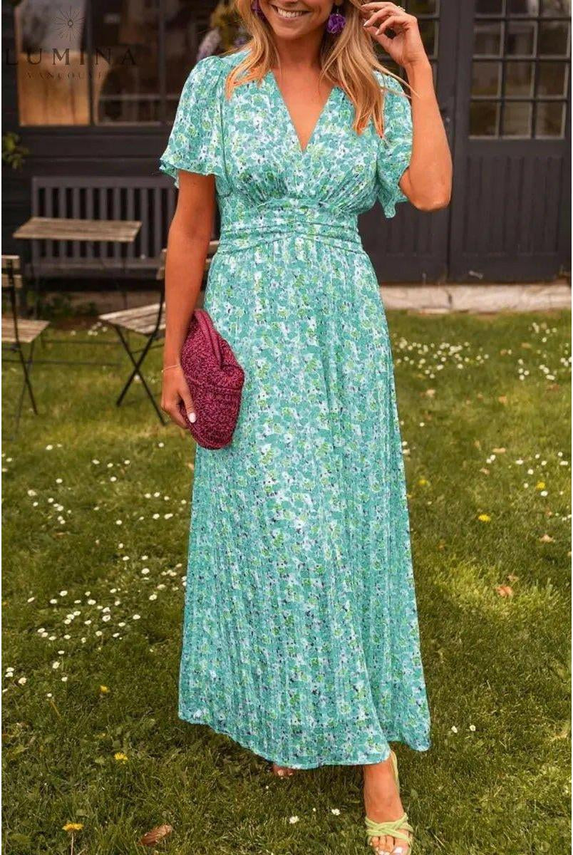 Orange Isabella maxi dress by Lumina Vancouver, elegant wedding guest dress with flowing fabric and stylish design.