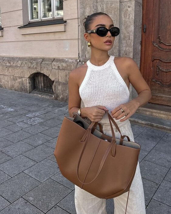 Brown oversized vintage Lumina Wear handbag with versatile straps, shown with multiple carrying options and detailed textured leather.
