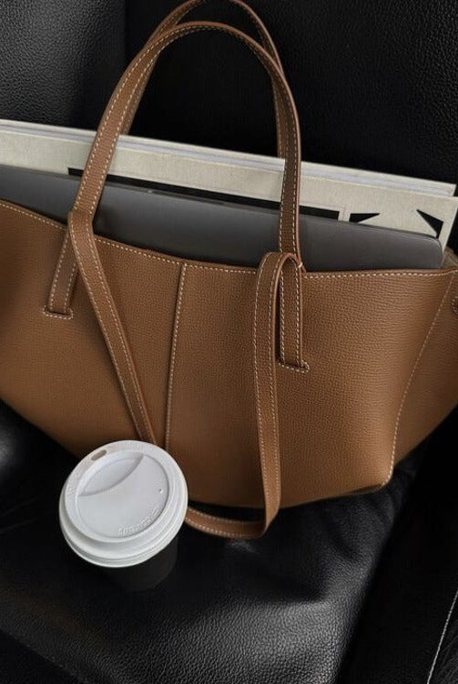 Brown oversized vintage handbag with versatile straps from Lumina Wear, featuring detailed stitching and spacious interior.