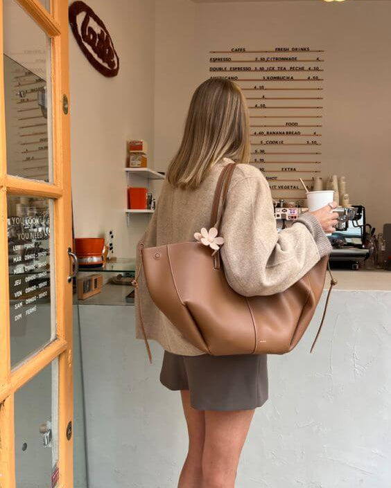 Lumina Wear Isabella oversized vintage handbag with versatile straps, brown leather design, showing front view and adjustable strap details.