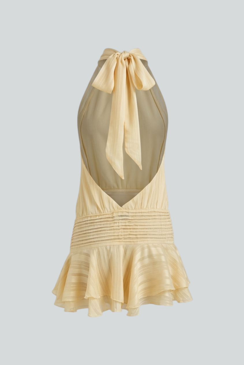Isabella Lumina yellow mini dress with playful fit, casual style, feminine silhouette, worn by a model in a bright outdoor setting.