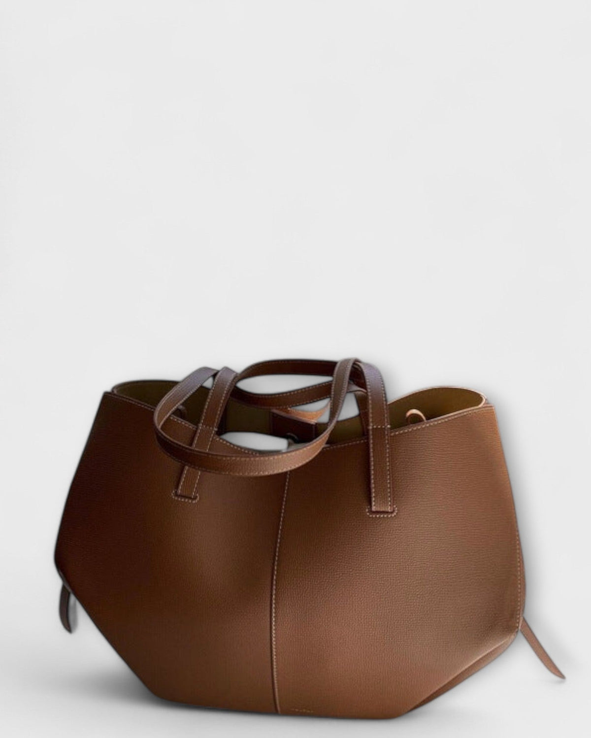 Lumina Wear Isabella minimalist tote bag in brown with sculpted design and spacious interior, measuring 32x13x22cm.