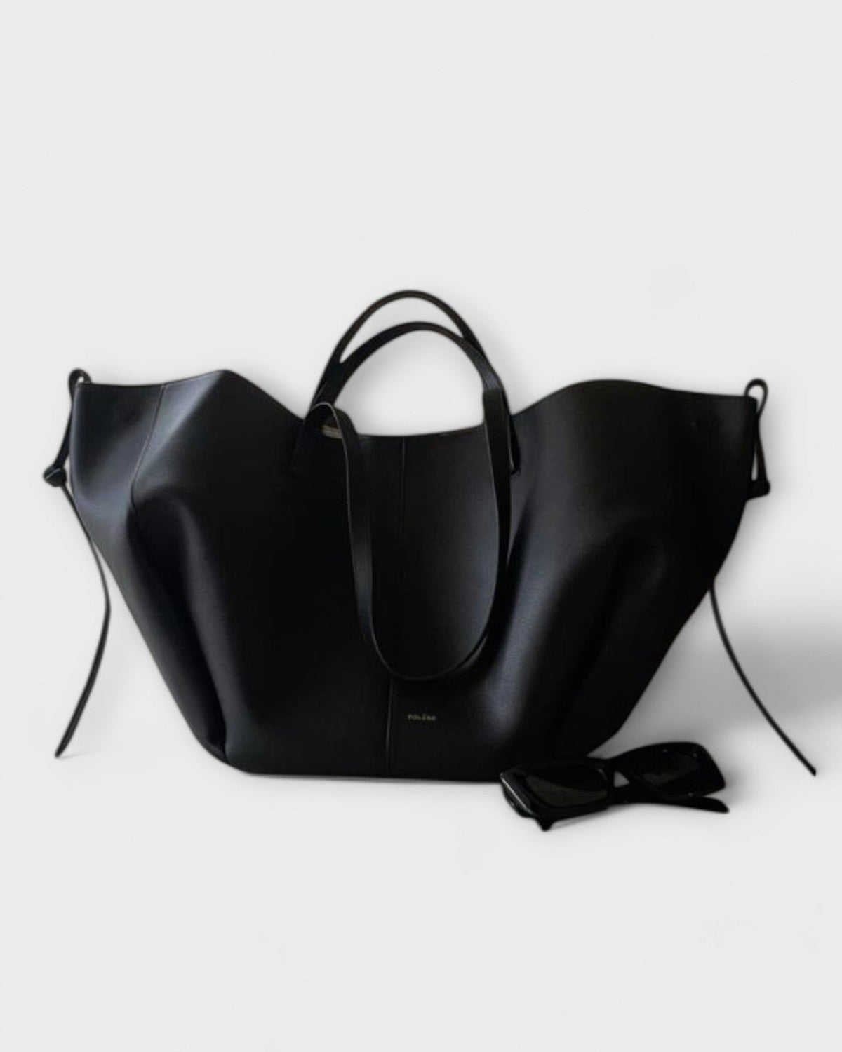 Lumina Wear Isabella minimalist tote bag in brown with sculpted design, spacious interior, measuring 32x13x22cm.