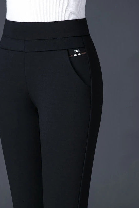 Lumina Wear Isabella high waist black leggings with faux pockets, showing a close-up of sleek, stretchy fabric and stylish fit.