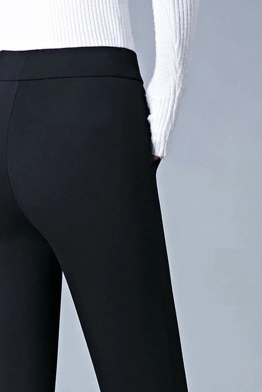 Black high waist leggings with faux pockets from Lumina Wear, featuring a sleek design and comfortable fit.
