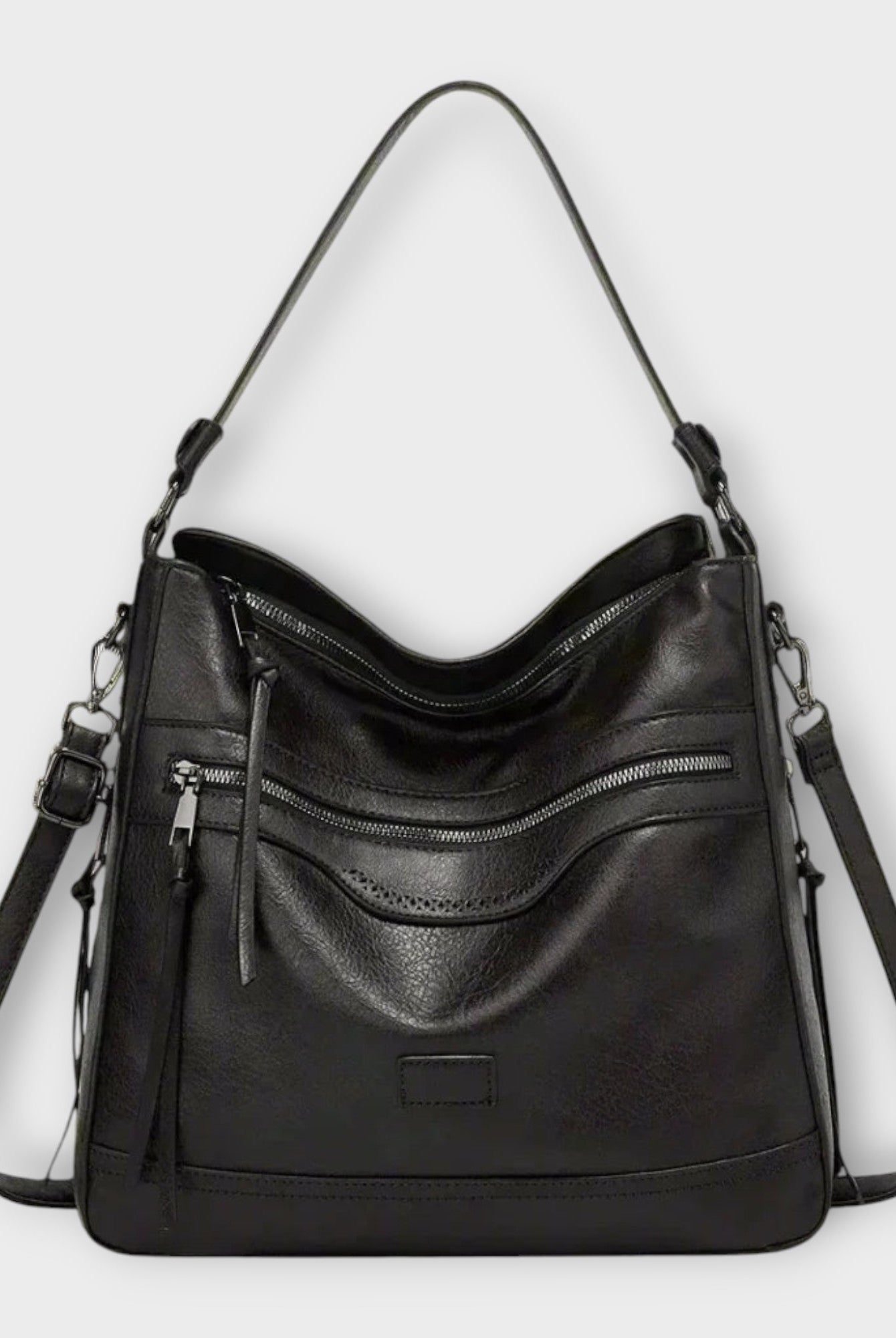 Black Isabella Lumina Wear slouchy shoulder handbag with versatile straps, featuring a spacious interior and stylish design.
