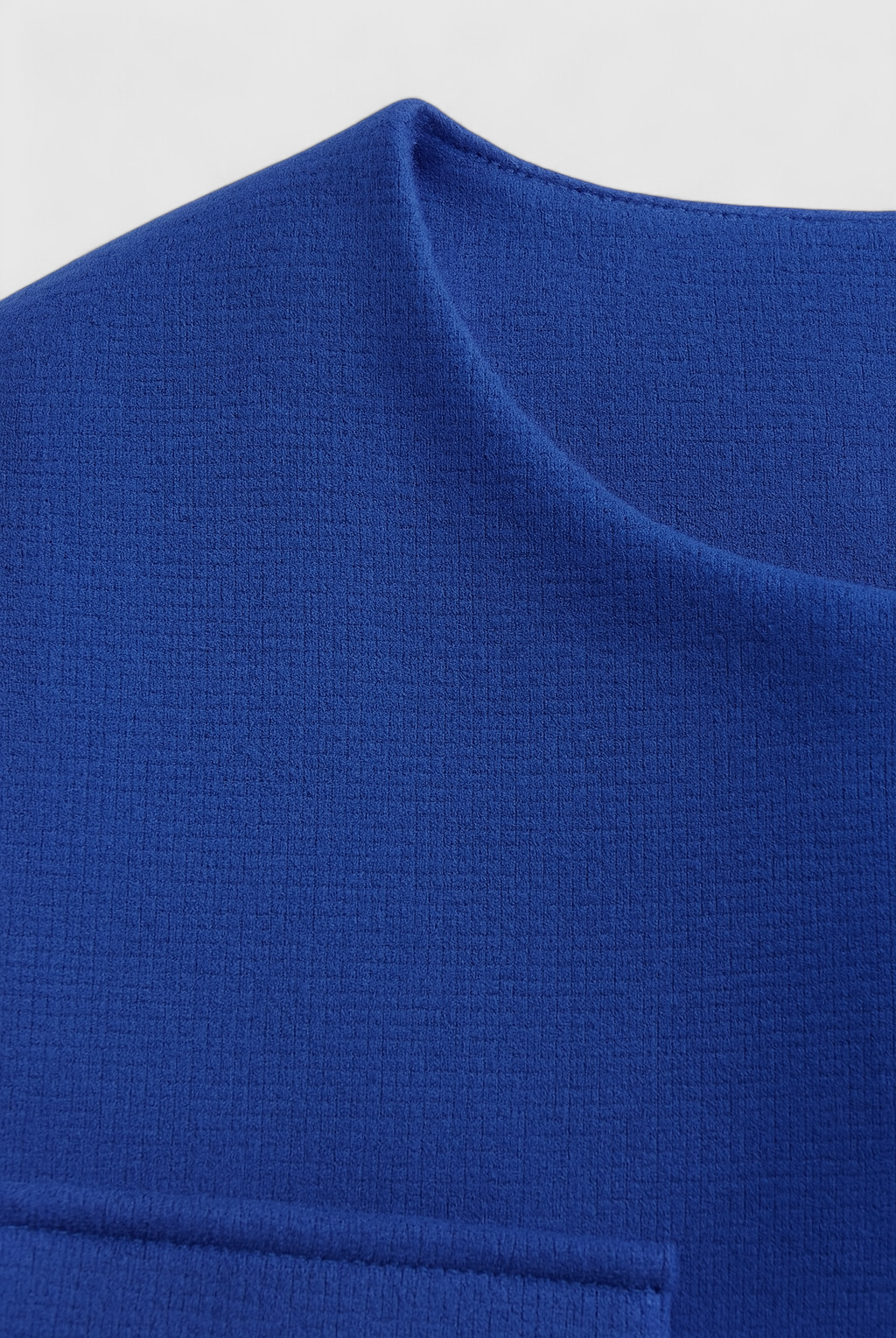 Blue winter jacket by Lumina Wear, Isabella style, featuring versatile design and stylish details, perfect for cold weather.