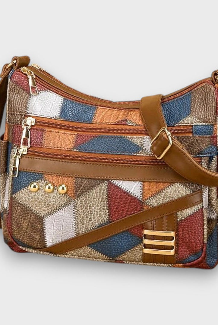Isabella textured patchwork shoulder bag by Lumina Wear with faux-leather accents, featuring a stylish design and adjustable strap.