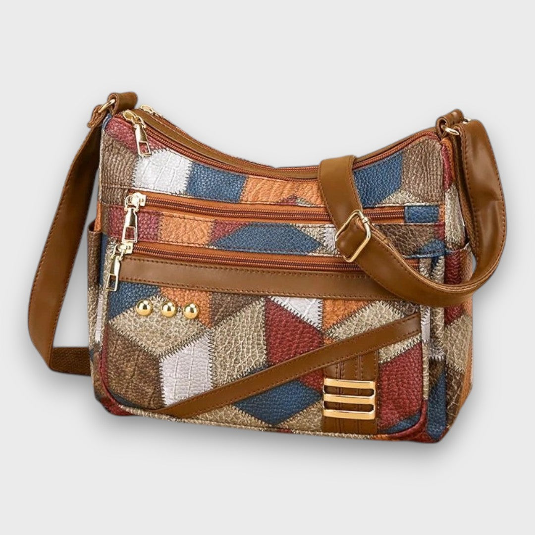 Isabella textured patchwork shoulder bag by Lumina Wear with faux-leather accents, featuring a stylish design and adjustable strap.