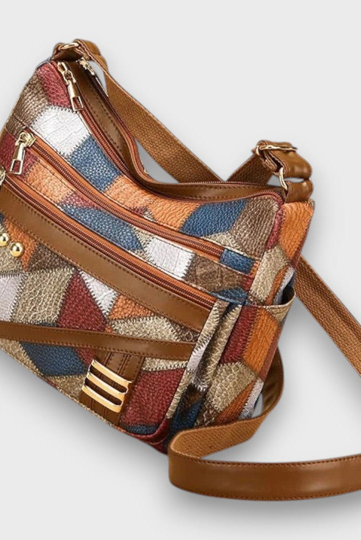 Isabella textured patchwork shoulder bag by Lumina Wear with faux-leather accents, featuring a stylish and functional handbag design.