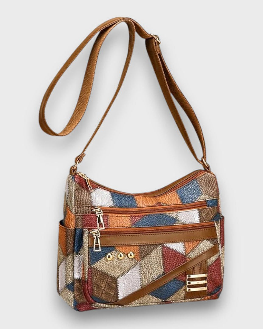 Isabella textured patchwork shoulder bag by Lumina Wear with faux-leather accents, featuring a stylish and versatile handbag design.