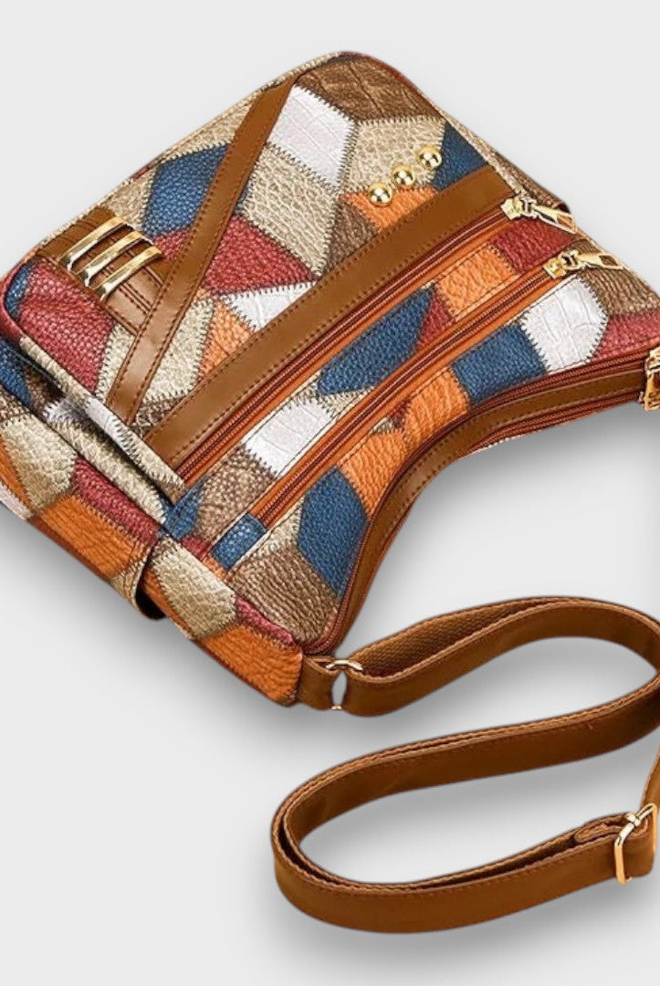 Isabella textured patchwork shoulder bag with faux-leather accents from Lumina Wear, featuring a stylish design and shoulder strap.