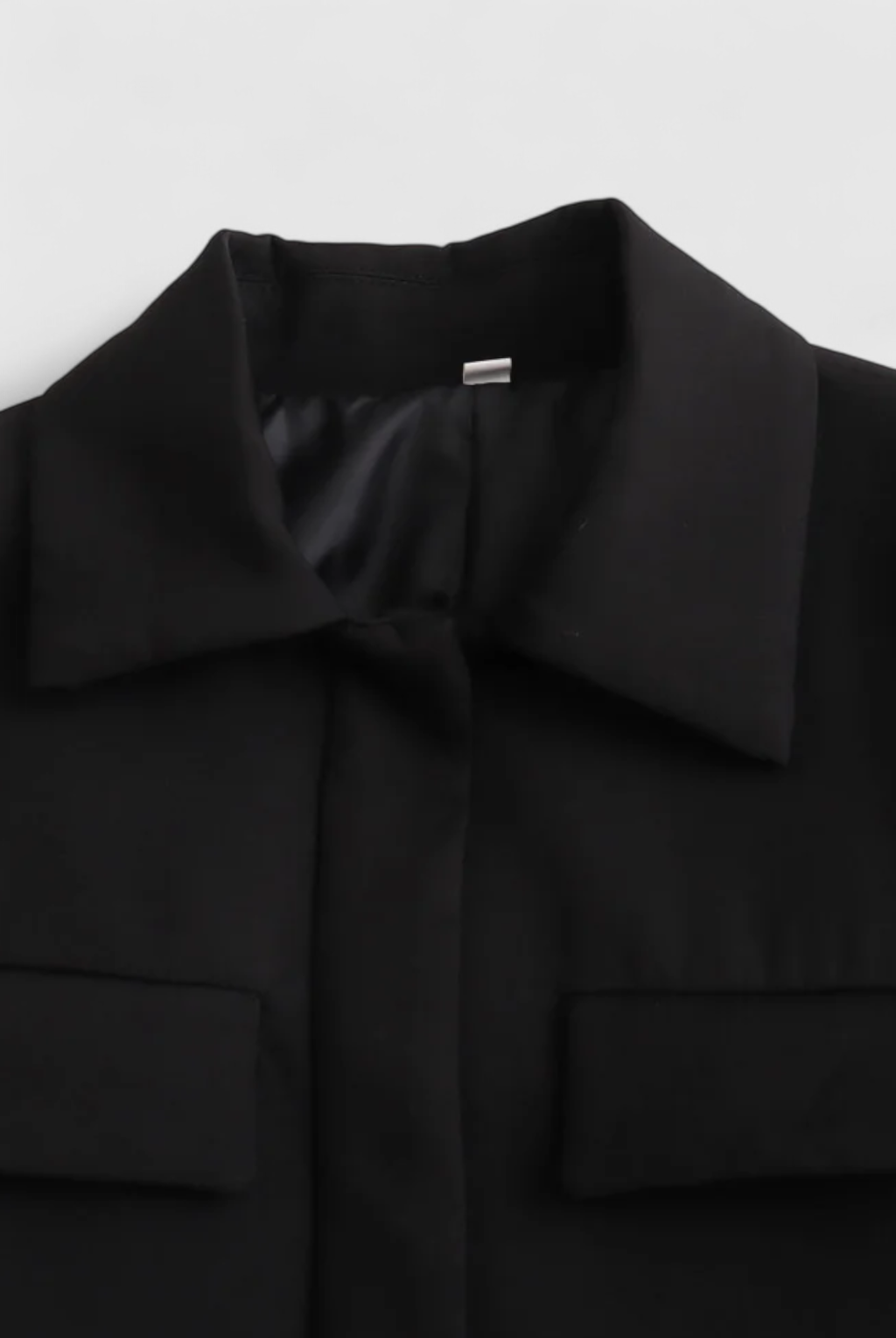 Black Isabella Lumina women's cropped jacket with a tailored fit, displayed on a model showcasing the stylish design.