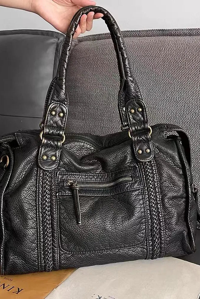 Lumina Wear Isabella vintage-inspired black handbag with spacious interior and elegant design, perfect for stylish everyday use.