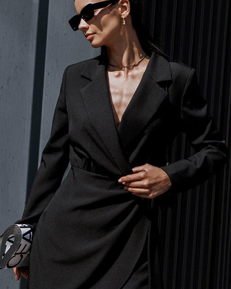 Isabelle black trench mini dress by Lumina Wear, featuring a classic trench style and fitted silhouette, shown in size S.