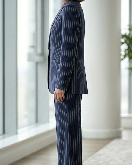 Navy blue Leandra double-breasted suit set by Lumina Wear, featuring tailored blazer and matching pants on a model.