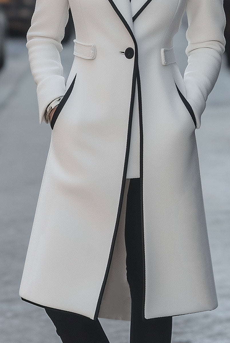 Long white Lumina Vancouver trilby coat with contrast trim, featuring a stylish and elegant design with a tailored fit.