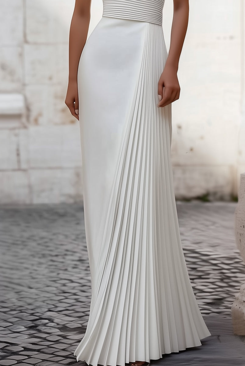 White Isabelle pleated halter-neck gown by Lumina Wear, elegant floor-length dress with a flowing silhouette.