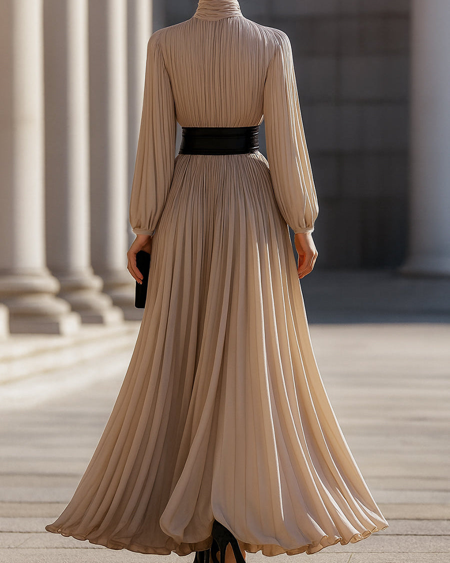 Beige Isabelle pleated high-neck maxi dress by Lumina Wear, shown on a model with flowing fabric and elegant design.