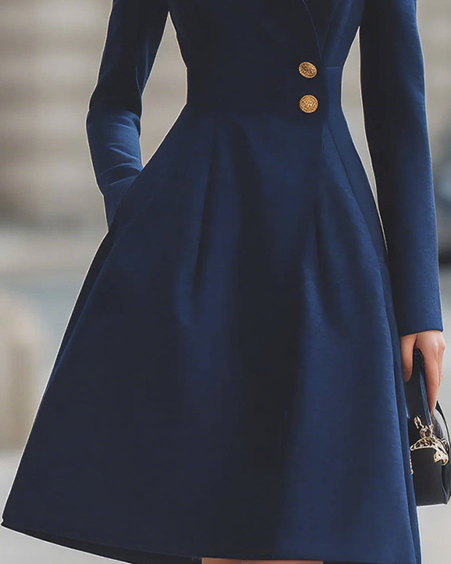 Navy blue Ottavia Tailored Fit Flared Peak Lapel Coat Dress by Lumina Wear, midi length, styled on a mannequin.
