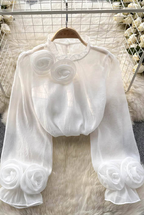 White blouse with 3D rose embroidery by Lumina Vancouver, featuring a stylish and elegant design, shown in size XS.