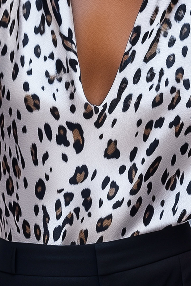 White leopard print halter top blouse by Lumina Vancouver, featuring a stylish design and comfortable fit.
