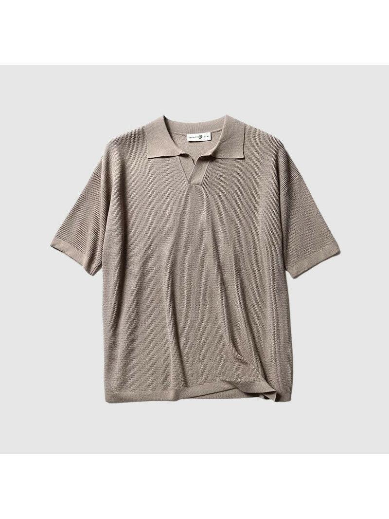 White Jack Washington oversized polo shirt by Lumina Vancouver, displayed on a hanger with a close-up of fabric texture.