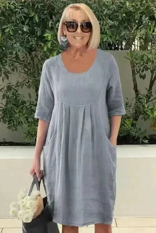 Blue loose dress with pockets by Lumina Wear, featuring a relaxed fit and casual style, shown on a model.