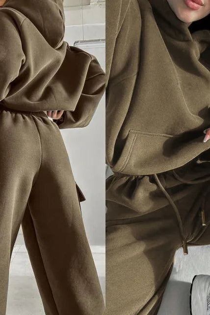 Black Jasmine Lumina Wear relaxed fit cargo pocket hoodie and sweatpants tracksuit set, shown on a model.