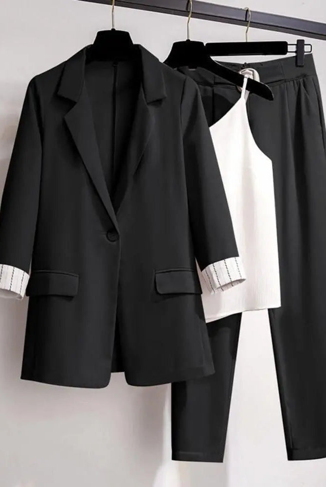 Black women's 2-piece set with tailored blazer, sleek pants, and versatile top from Lumina Wear, styled for a chic look.