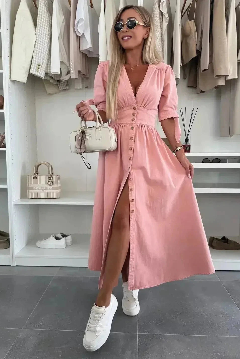 Pink denim dress named Julie by Lumina Wear, displayed on a hanger with a casual, stylish fit perfect for everyday wear.