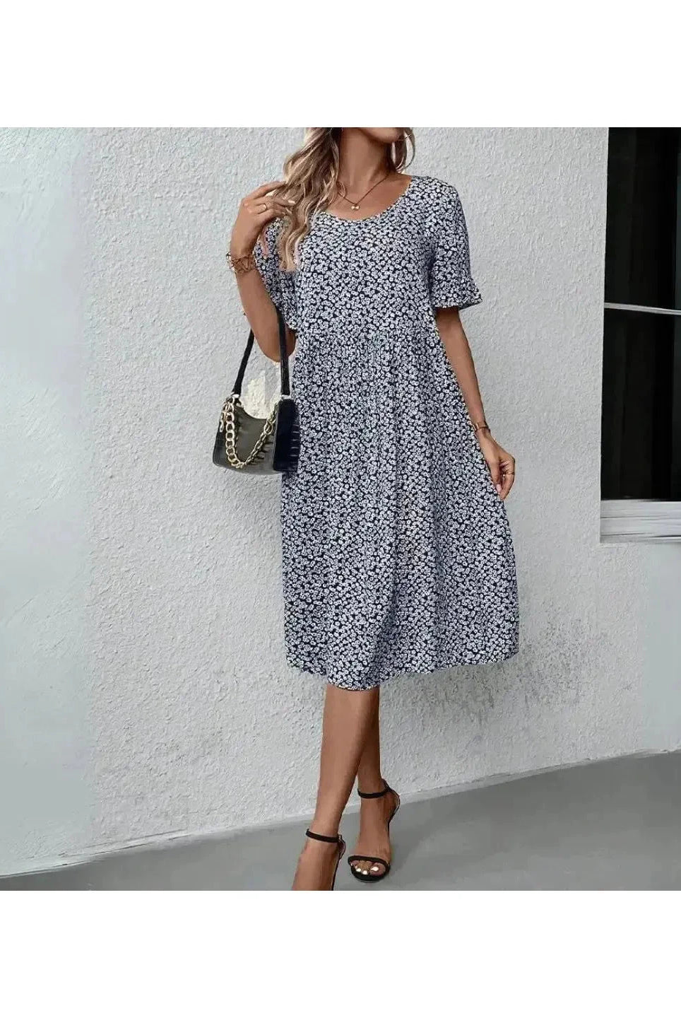 Blue floral printed dress by Lumina Wear, casual style with lightweight fabric, featuring a relaxed fit and floral pattern.