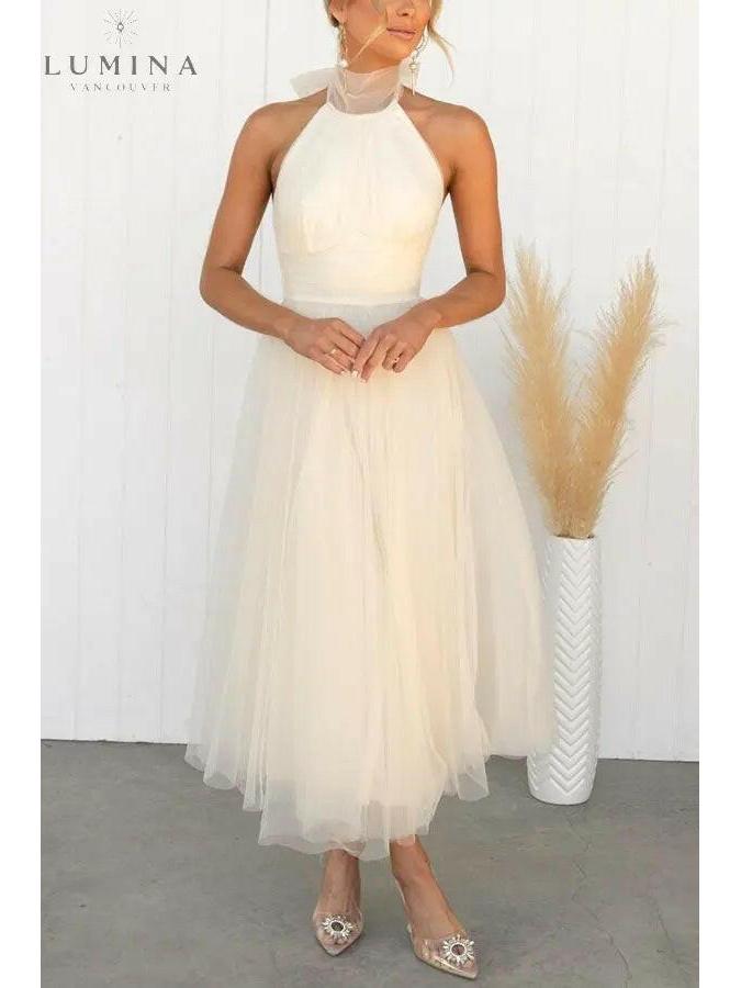Kaylee fairy dress in creme for wedding guests by Lumina Vancouver, featuring a whimsical design for special occasions.