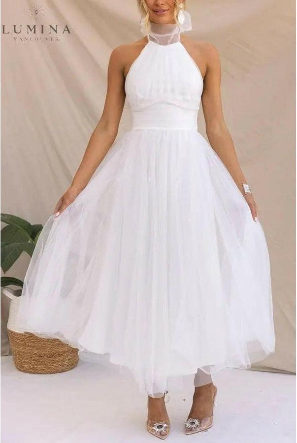 Kaylee fairy evening dress in creme by Lumina Wear, featuring delicate details, suitable for wedding guests or special occasions.