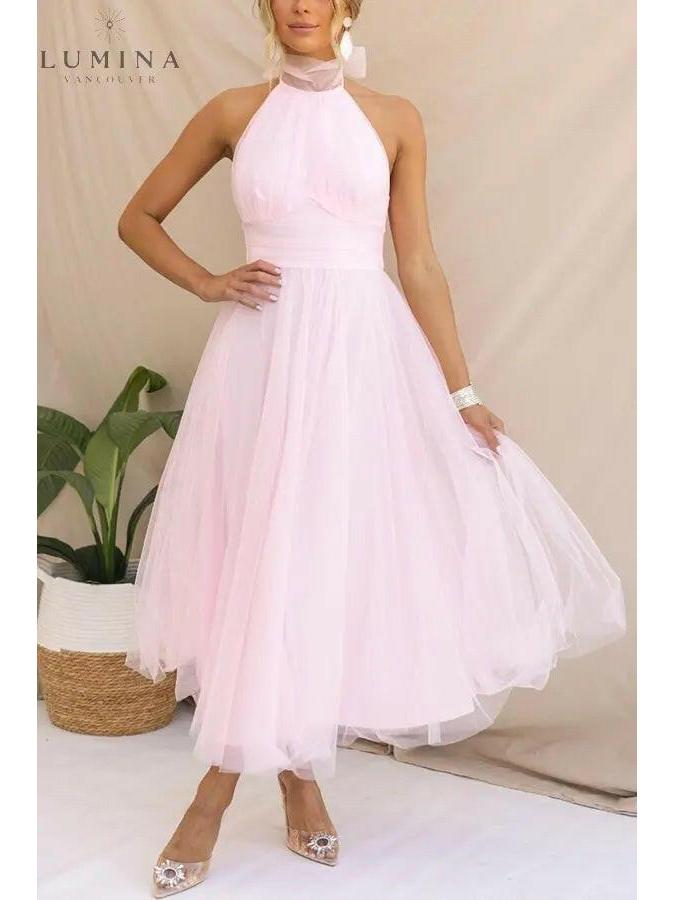Kaylee fairy wedding guest dress in creme by Lumina Vancouver, featuring a flowy, elegant design suitable for special occasions.
