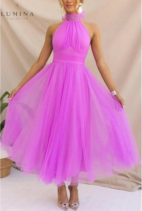 Cream-colored Kaylee Fairy Dress by Lumina Wear, elegant evening dress with delicate details, suitable for wedding guests.