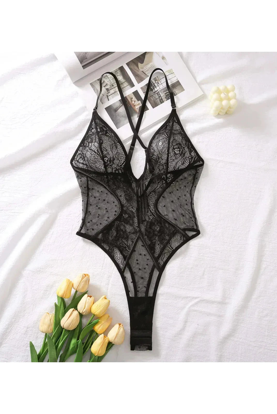 Lumina Wear Keira's Bodysuit, a sleek black bodysuit with long sleeves and fitted silhouette, displayed on a mannequin.