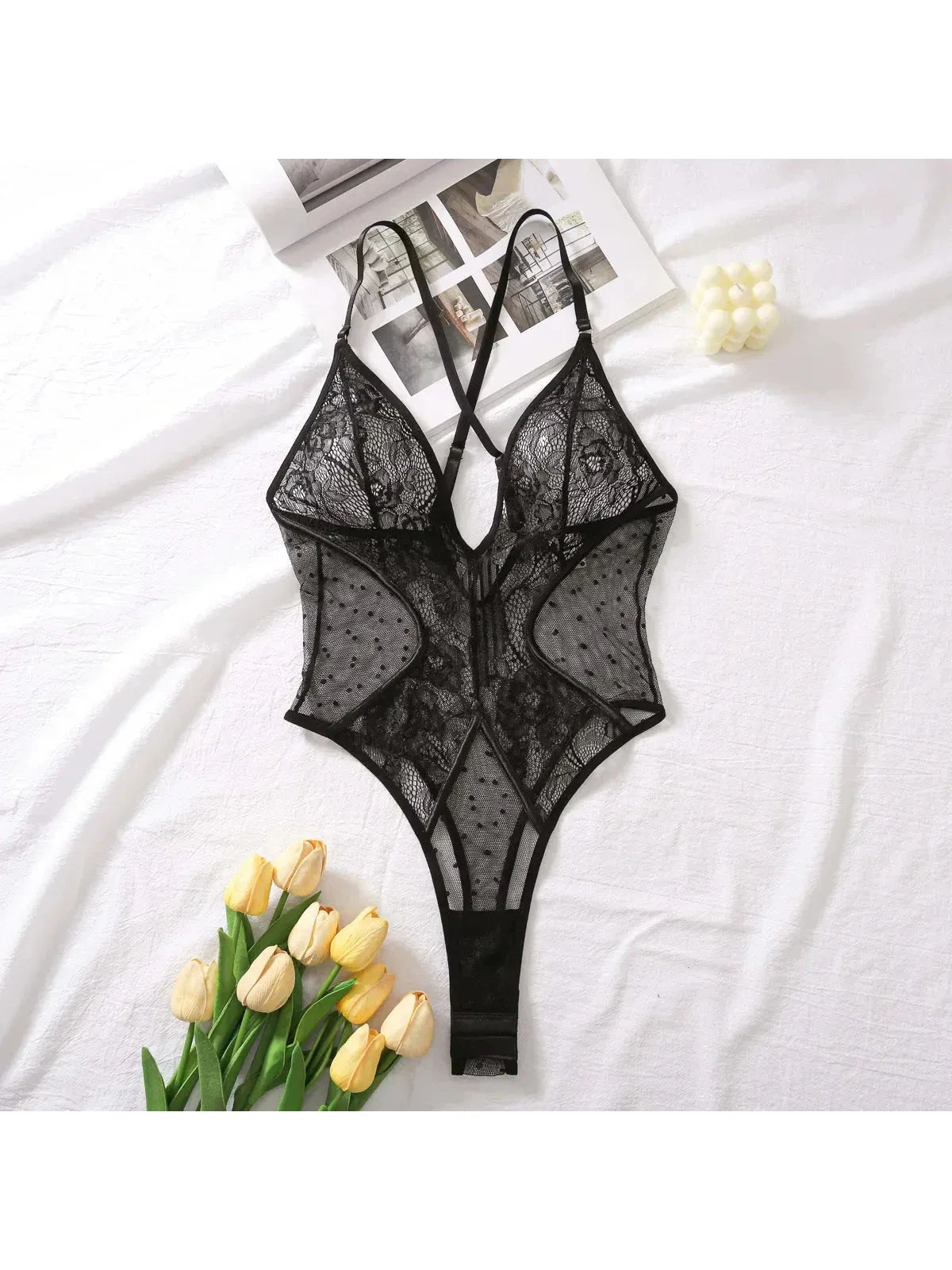 Lumina Vancouver Keira's Bodysuit, a sleek fitted bodysuit with long sleeves and scoop neckline, on a neutral background.