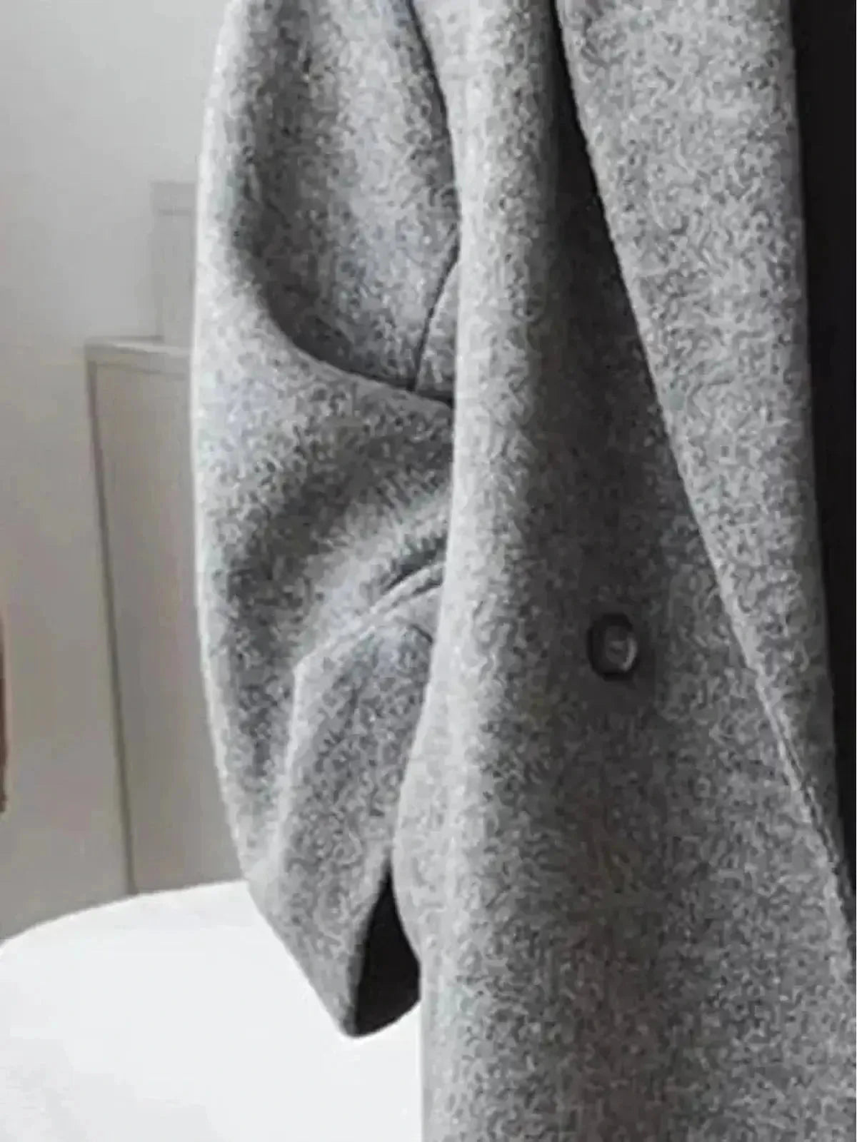 Lumina Wear Kelly™ women's classic grey winter long coat, stylish and warm, displayed on a hanger.