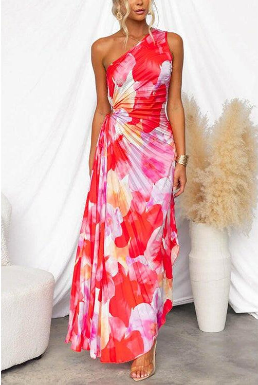 Red Kelsey pleated summer dress by Lumina Wear, featuring a flowy design perfect for warm-weather occasions.