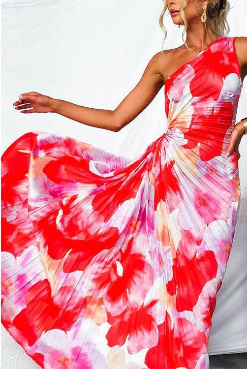 Red Kelsey pleated summer dress by Lumina Wear, stylish dress worn by a wedding guest, featuring flowing pleats and elegant design.