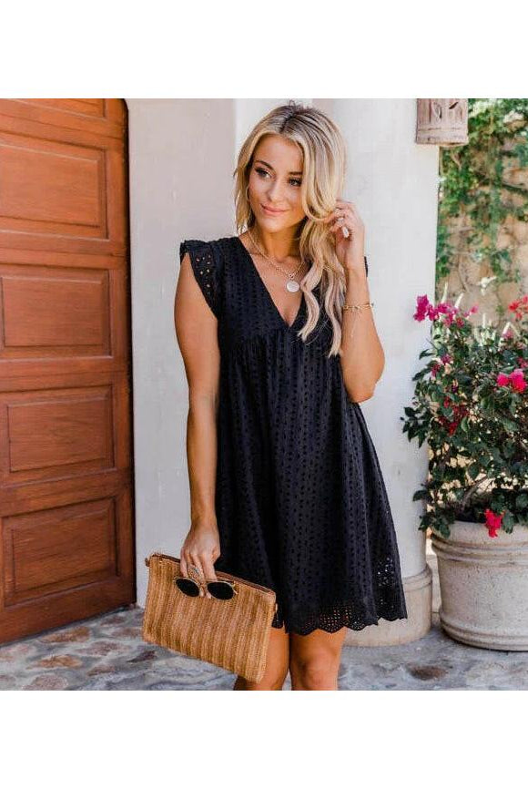 Black Kenna Breezy Summer Dress by Lumina Wear, lightweight and stylish, shown on a model in a natural outdoor setting.