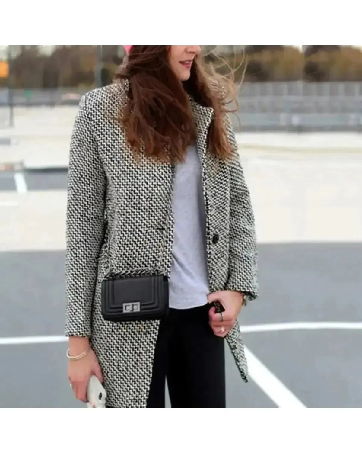 Elegant long wool coat from Lumina Wear's Klara collection, shown in a stylish, tailored design with a classic collar and button details.