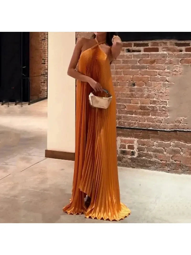 Orange Kyla maxi dress by Lumina Vancouver featuring chic pleated design and halter neck, shown in size XS.