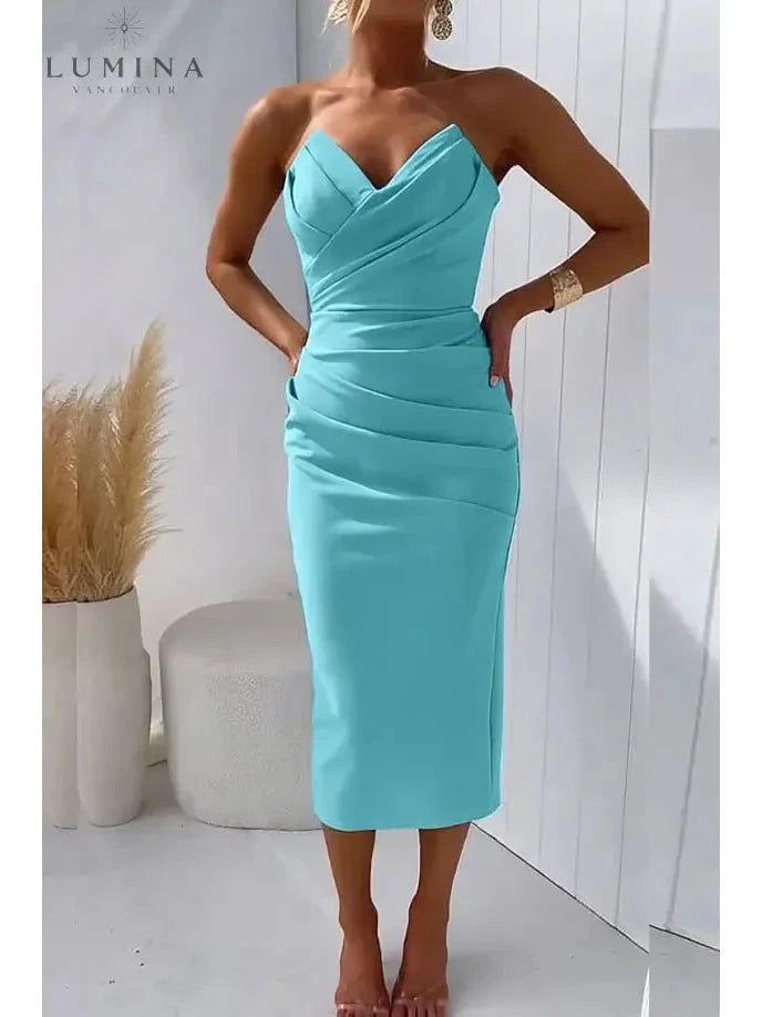 Blue Laura strapless wedding guest dress by Lumina Vancouver, elegant sleeveless gown with fitted bodice and flowing skirt.