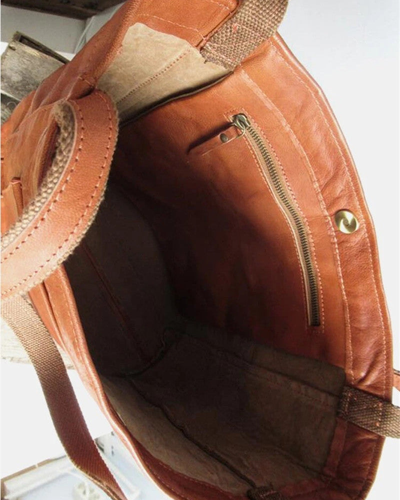 Lumina Wear Lauren black leather handbag with spacious interior, stylish design, and brown accents, measuring 36x13x42cm.