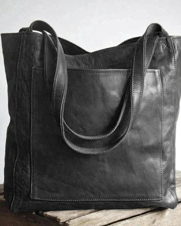Lumina Wear Lauren elegant black leather handbag with spacious interior, showcasing its stylish design and practical size.