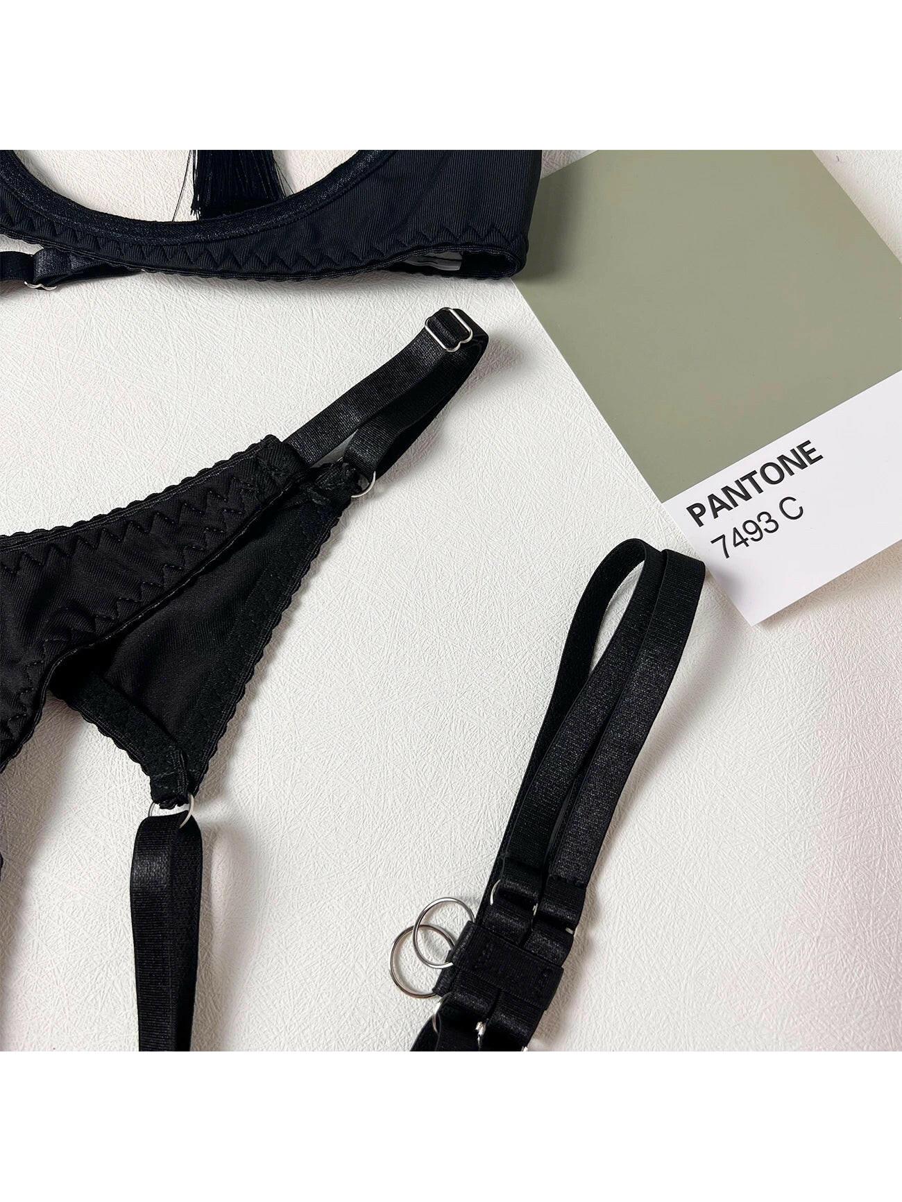 Black Layla tassle lingerie set by Lumina Vancouver featuring lace details and delicate tassles, displayed on a model.